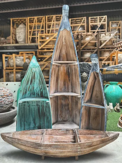 For decor that's both functional and full of personality. Our reclaimed wooden boat shelves are a quirky, nautical-inspired way to display your favorite books and treasures, adding a touch of coastal charm to any room.