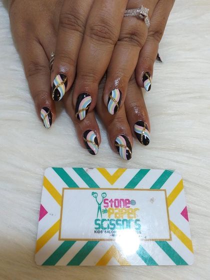 This intricate design features crisscrossing pastel ribbons over a black base. I added a gold stripe through the center to give it a luxurious, high-fashion feel.