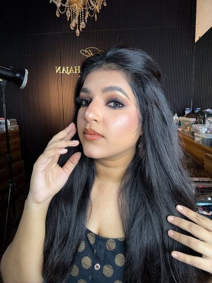 A classic smokey eye look with a nude lip. This is a timeless look that is perfect for any party or event.