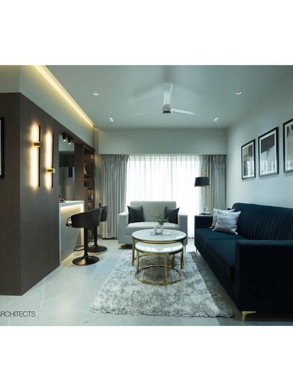 The complete living room at Tulsi Heights, showing the breakfast bar, sofa arrangement, and dining nook. This project is a great example of our expertise in transforming compact apartments into highly functional and stylish homes.