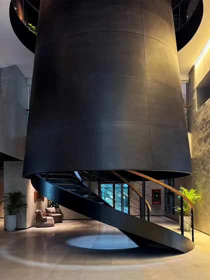 A view of the dramatic, cone-like structure housing the central staircase at BCG HQ, a form that echoes Bombay's industrial heritage.