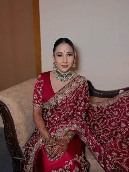 A full seated portrait of my bride for her engagement. The makeup is classic and sophisticated, perfect for the occasion.