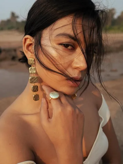 A campaign shot for Noupelle Studio, a jewelry brand. I created a natural, beach-ready look with dewy skin and wind-swept hair to complement the brand's organic and artisanal aesthetic.