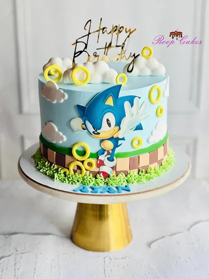 A super-sonic celebration for a special birthday. This cake brings the world of Sonic the Hedgehog to life with golden rings, fluffy clouds, and the speedy hero himself.
