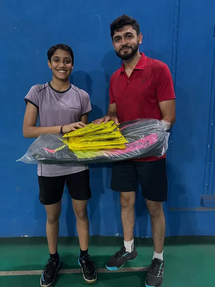 Celebrating another champion's success with new equipment. At my academy, we train and win as a team.