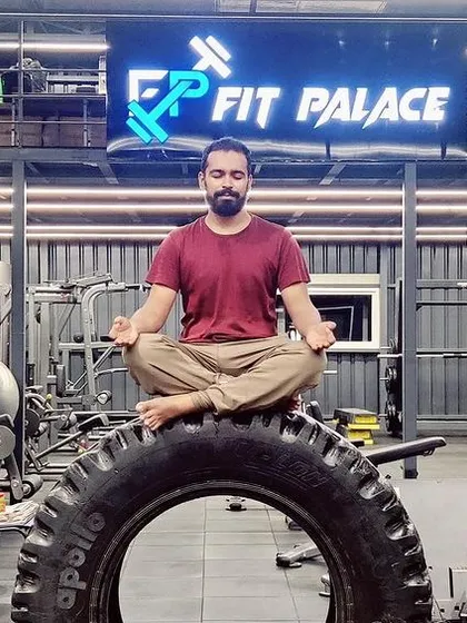 This is what my integrated fitness philosophy looks like. I find stillness and focus through meditation, even in the middle of a gym surrounded by strength equipment. It's about balancing the calm of yoga with the power of functional training.