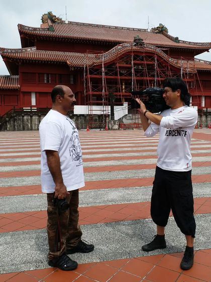 During a filming session in Okinawa, with the historic Shuri Castle in the background. I am often asked to share my knowledge of traditional karate with international audiences.