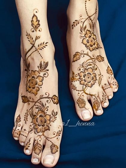 A slightly different angle of the beautiful floral vine foot design, showing how it gracefully adorns the feet.