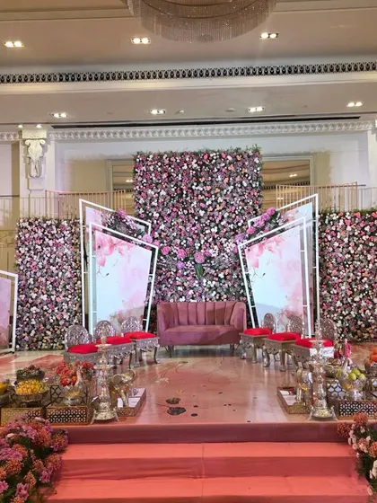 A wide view of the modern pink stage, showing the full setup with seating.