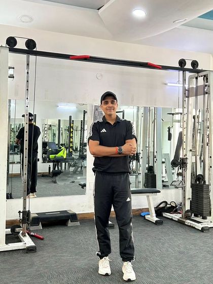 A confident pose in the gym at Noida Sector 45. I'm ready to help you achieve your goals.