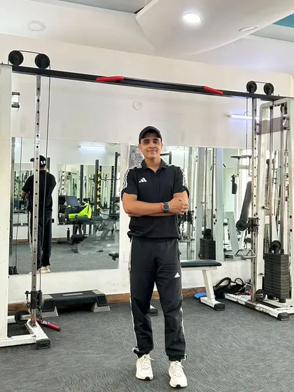 A confident pose in the gym at Noida Sector 45. I'm ready to help you achieve your goals.