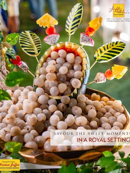 Savour the sweet moments in a royal setting. A beautiful presentation of fresh lychees with carved fruit skewers, perfect for adding a touch of tropical elegance.