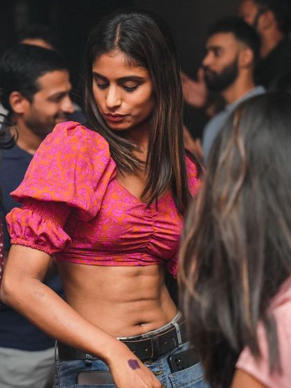 A guest dancing and enjoying the music at our 'Bollywood Republic' night. The energy on the dance floor is always electric.