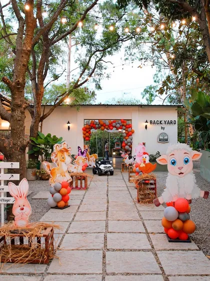 Another view of the farm-animal themed birthday party at The Backyard. The stone pathway leads guests through a fun and interactive entrance experience.