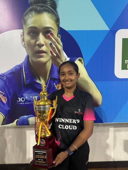 Rashi V Rao with her trophy after securing Bronze in the Under 15 Girls singles, her third consecutive podium finish at the state level.