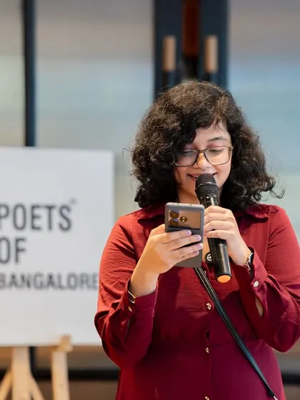 A poet reads a heartfelt piece, likely dedicated to her mother. The event was filled with emotional and touching performances.