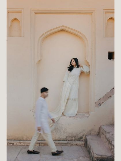 An artistic motion-blur shot in Jaipur, capturing the dynamic between stillness and movement. This creative technique adds a story-like quality to the pre-wedding portrait.