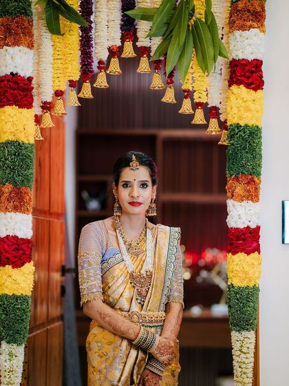 A picture-perfect family celebrating their housewarming. I had the pleasure of dressing my client Archana in a hand-worked blouse, her husband in a custom shirt, and their son in a charming Kalamkari kurta.