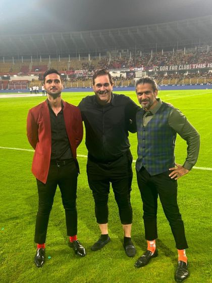 A fun and stylish trio at the Indian Super League. I incorporated bold colors like a red blazer and playful accessories like patterned socks to add personality to their looks.