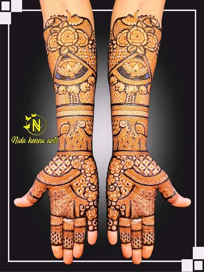 This is a classic, full-coverage Indian bridal design. It shows how I use traditional motifs like florals, lotuses, and intricate jaal patterns to create a rich, dense look that extends up the arms for a truly royal feel.