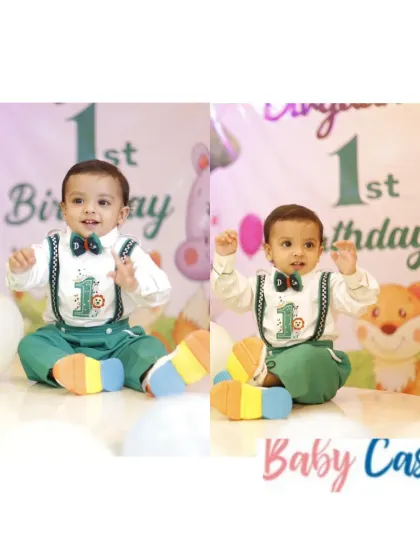 Ready for his first birthday party. This little one is wearing our green suspender set with a '1' patch, a popular choice for parents looking for a cute and memorable outfit for the big milestone.