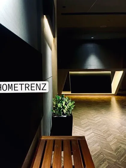 A glimpse of our studio's reception area. The design reflects my brand's aesthetic: modern, sophisticated, and welcoming, with a focus on clean lines and dramatic lighting.