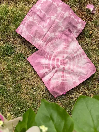 The beautiful results you can achieve with our tie-dye kit. These organic cotton napkins feature two different patterns, both created with the same natural pink dye.