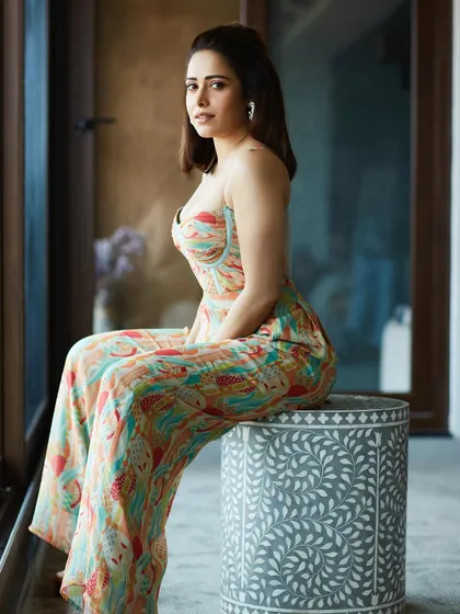 This printed bustier jumpsuit is a versatile piece I chose for Nushrratt Bharuccha's promotions. It's stylish, comfortable, and perfect for a long day of interviews and appearances.