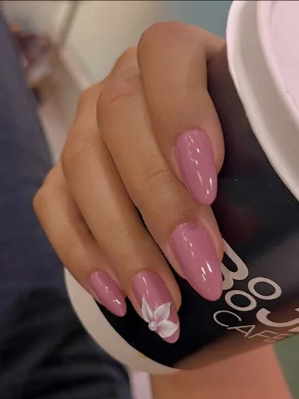 Because regular nails are too basic. Go 3D with this beautiful floral accent nail. The delicate white flower is sculpted from acrylic, adding a touch of elegance and dimension to this mauve manicure.