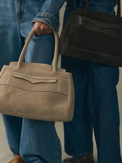 An exploration of silhouette and material with our Penny Carryall bags in sumptuous suede. I designed these to be a modern, unisex classic, combining a structured form with the soft, yielding texture of premium suede for a piece of everyday luxury.