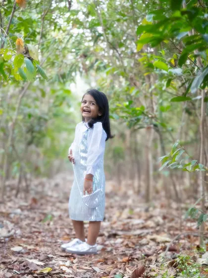 A burst of laughter in the woods. Letting kids explore natural surroundings always leads to the most genuine expressions and beautiful, candid shots.
