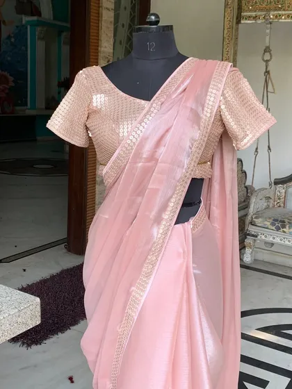 The 'Gulabi' saree draped on a mannequin, showing its elegant and classic silhouette. This piece is fully customizable in the color of your choice.