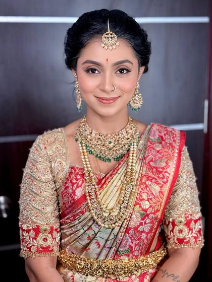 A direct, confident portrait of the client, looking radiant and poised.