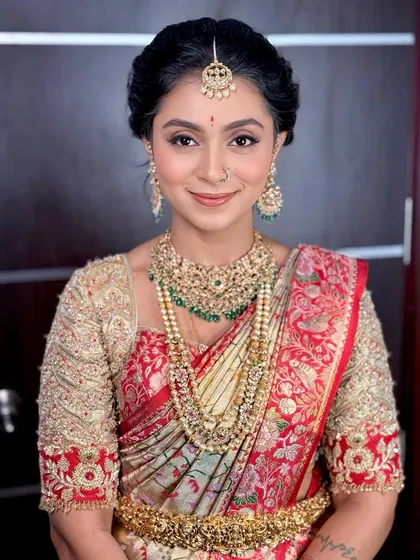 A direct, confident portrait of the client, looking radiant and poised.