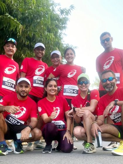 Another fantastic group from our ASICS running club, posing for a team photo after a successful run.