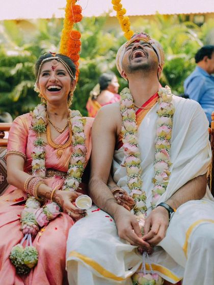 A duplicate of the couple sharing a hearty laugh on the wedding swing.