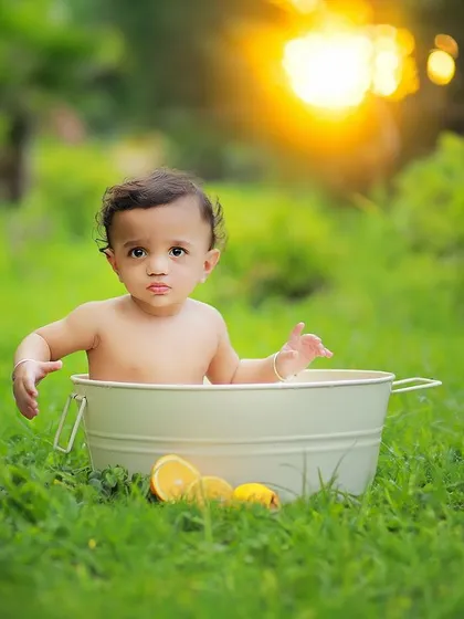 We also offer fun and creative concepts for outdoor shoots, like this adorable bubble bath setup. It's a unique way to capture playful moments with your little one.