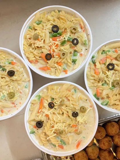 Bowls of creamy White Sauce Pasta, a favorite among teens.