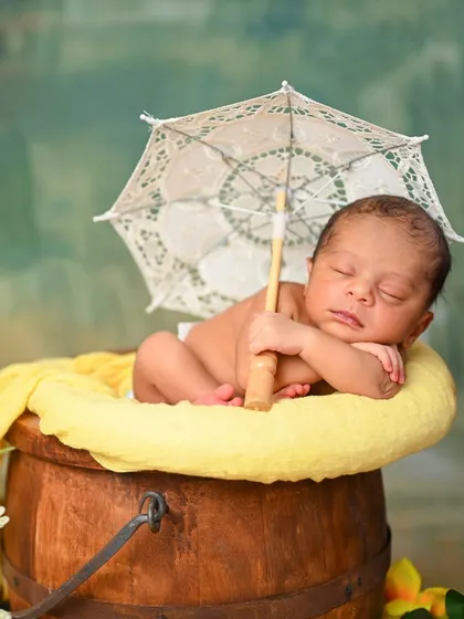 A duplicate of image 31, a cheerful and vibrant newborn portrait.
