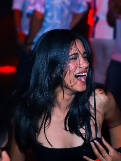 A candid shot of a guest laughing and having a great time.