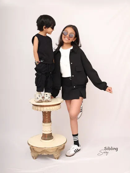 More than just siblings, they're built-in best friends. This fun, modern portrait captures the cool confidence and unique bond between a brother and sister.