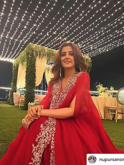 A candid moment from the beautifully lit Diwali celebration, showcasing the warm and inviting atmosphere.
