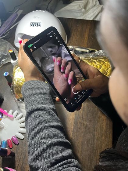 Here I am, capturing a photo of the finished ombré nails. I always make sure to get the perfect shot to showcase the final look.