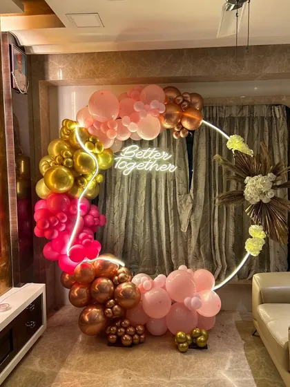 This wider shot shows how our balloon ring decor can transform a corner of a living room into a festive and photo-worthy spot for any celebration.