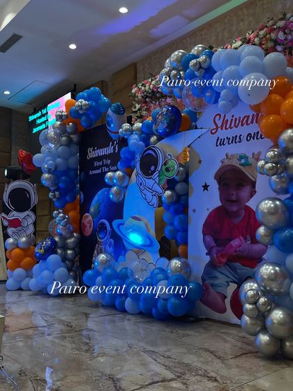 Another angle of the space-themed stage decoration. This view shows how the balloon arches and themed backdrops come together to create a dynamic and exciting party environment.