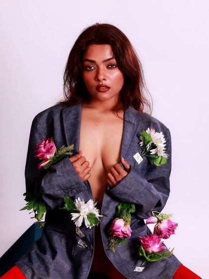 A fine art concept exploring the fusion of fashion and nature. The blazer adorned with flowers creates a surreal and beautiful image that speaks of growth and beauty.