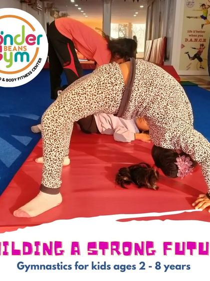 Once the basics are right, our children can reach for the sky. This student demonstrates a perfect arch, a foundational pose that builds a strong and flexible back for more advanced skills.