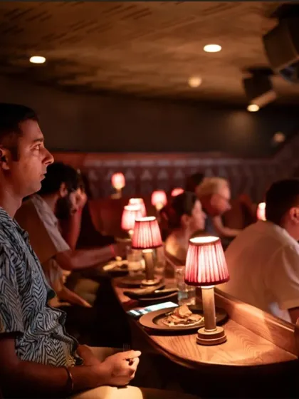 A guest completely engrossed in the film at our Ratatouille screening. The warm, focused lighting and intimate seating at The Piano Man allow for a truly immersive experience where you can lose yourself in the story.