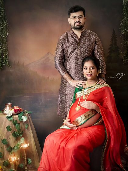 A classic portrait from a Maharashtrian-style maternity shoot. The couple is dressed in traditional attire, creating a timeless image that feels like a royal painting.
