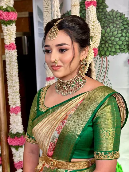 A side profile capturing the intricate details of the hairstyle and jewellery.